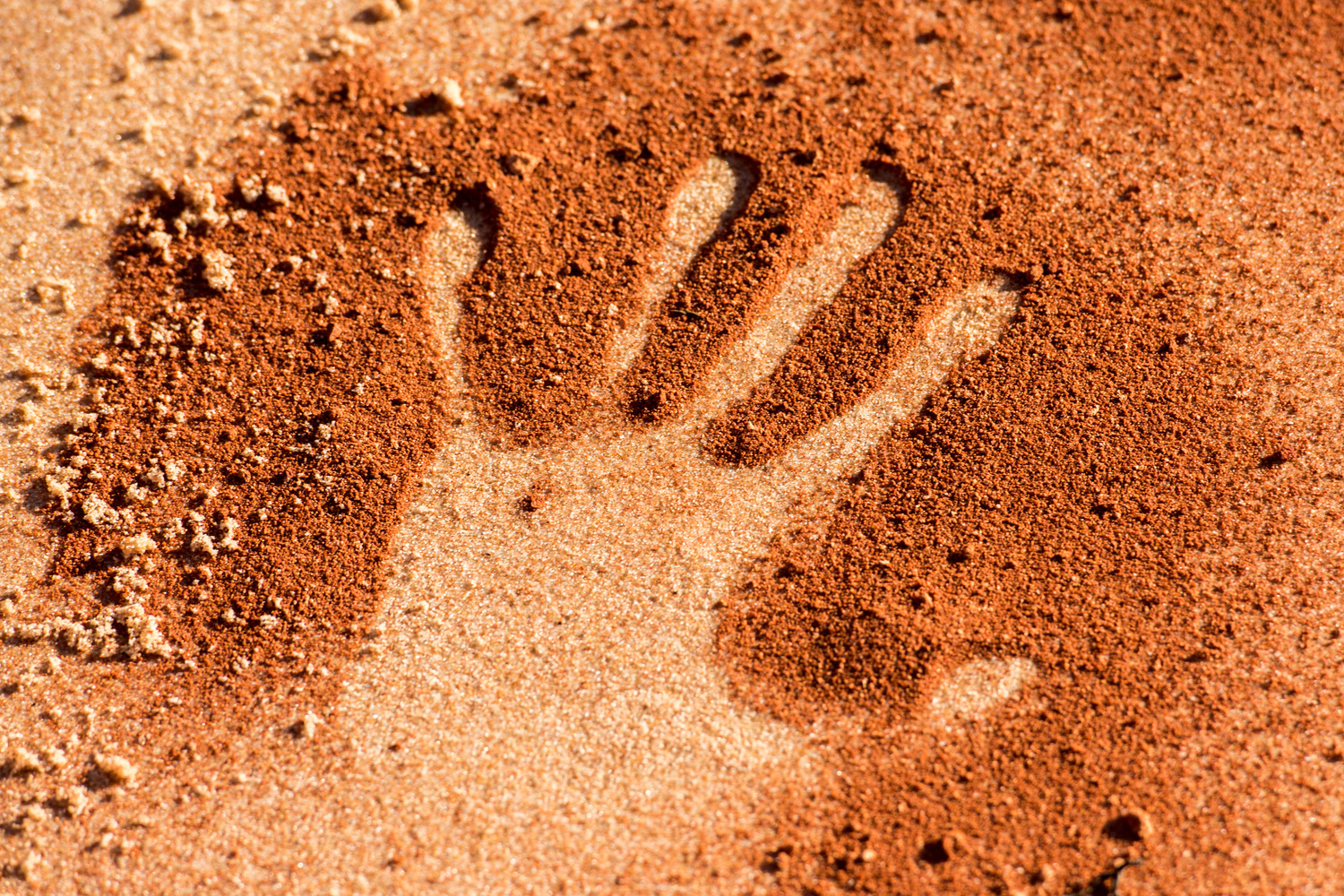 hand shape on sand like aboriginal art style